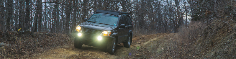 2006 Lexus GX470 featuring DENALI D7 LED Driving Lights, SoundBomb horn, and DialDim Universal Controller